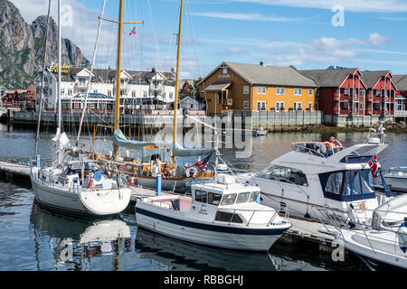Svolvaer harbor, view over anchored sailing boats to Anker Brygge, center of conference facilities and restaurant,  Lofoten Stock Photo