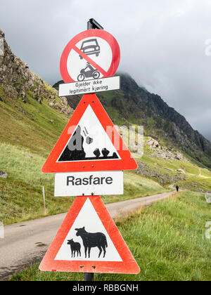 Old pass, mountain road from Haukland beach to Uttakleiv, warning signs, no public traffic, be aware of sheep and avalanches, Utakleiv, island Vestvag Stock Photo