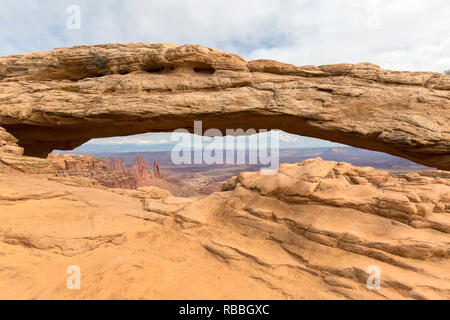 View of and through Mesa Arch of Canyonlands National Park, autumn morning. Stock Photo