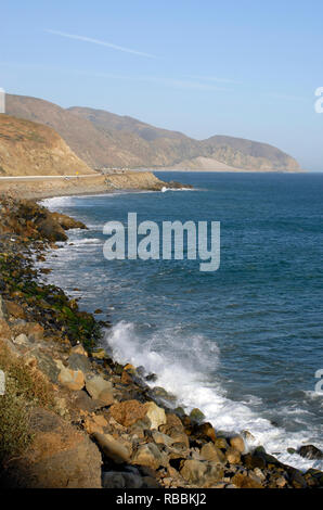 Vertical image showing the Pacific Ocean coastline along the Pacific Coast Highway at Point Mugu, California, located between Oxnard and Malibu. Stock Photo