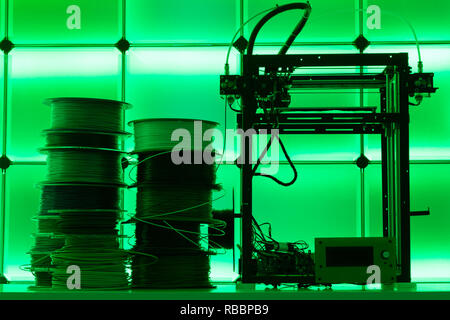 3D Printer and spools of plastic filaments Stock Photo