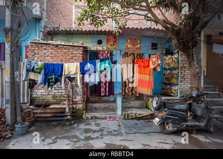 The Front Yard of a house in Madanpur Khadar, New Delhi. Through the front yard the street becomes part of the home. Stock Photo