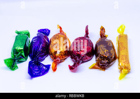 Quality Street chocolates photographed against a white background. Stock Photo