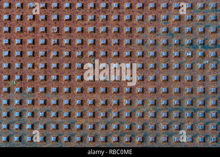 Square shapes on metal rusted surface with patterns and cracks - high quality texture / background Stock Photo