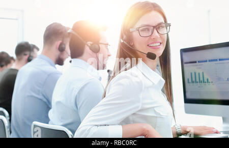 employee of the business center using the computers to analyze the data Stock Photo