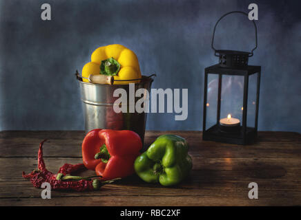 Food still life with red, yellow and green pepper, on a wooden background, spanish food Stock Photo