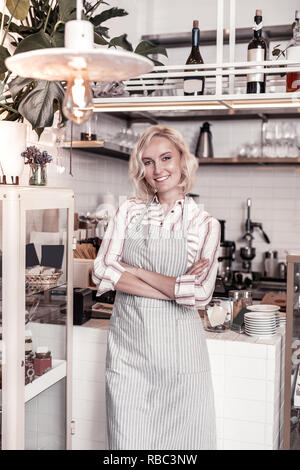 Delighted happy woman working in the cafe Stock Photo