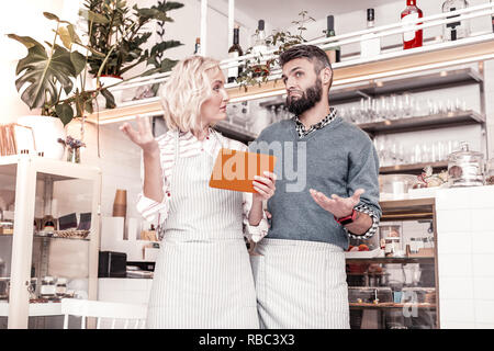 Nice pleasant colleagues discussing their ideas together Stock Photo