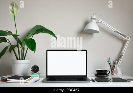 Modern work table with blank computer laptop and accessories in home office studio.Freelance designer or blogger concepts ideas.Background presentatio Stock Photo