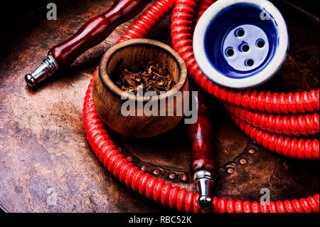 Oriental exotic hookah .Smoking turkish shisha.Tobacco in a snuffbox and hookah Stock Photo