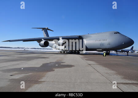 A C-5M Super Galaxy of the 433rd Airlift Wing, Lackland Air Force Base, Texas, shown on the Tinker AFB flight line after delivering outsized cargo to the Oklahoma City Air Logisitics Complex at Tinker AFB, Oklahoma, Jan. 4, 2019. The aircraft and crew delivered parts to repair a damaged B-1B Lancer which were pulled from long-term open storage at Davis-Monthan AFB, Arizona. (U.S. Air Force photo/2Lt. Ashlyn K. Paulson) Stock Photo