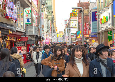 Harajuku street view. People, mostly youngsters, walk through Takeshita Street, a famous shopping street lined with fashion boutiques, cafes and resta Stock Photo