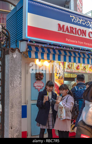 Harajuku street view. People, mostly youngsters, walk through Takeshita Street, a famous shopping street lined with fashion boutiques, cafes and resta Stock Photo