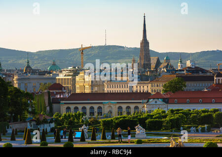 Vienna cityscape, view of the Vienna city centre skyline with the Schloss Belvedere palace in the foreground and Stephansdom cathedral spire beyond. Stock Photo