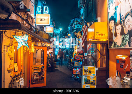 Shinjuku, Tokyo, Kanto region, Japan. Tiny alleys crowded with night bars and clubs at Golden Gai district. Stock Photo