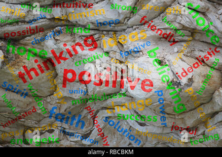 Colorful word cloud with words out of the area positive thinking - transparent against rocky background Stock Photo