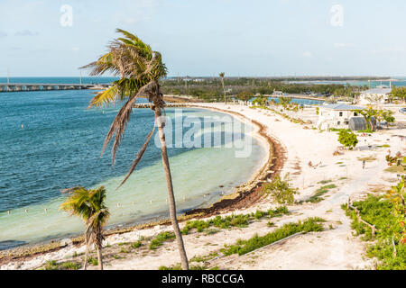 Bahia Honda Key, USA Florida state park bay in island with shore, coast, sand beach, people sitting on chairs after hurricane irma, damage Stock Photo