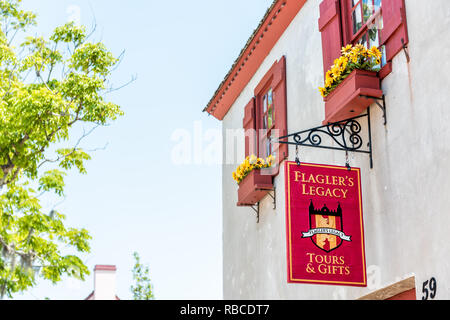 St. Augustine, USA - May 10, 2018: St George Street on sunny day with closeup of famous Flagler's Legacy tour gift shop souvenir stores in downtown ol Stock Photo