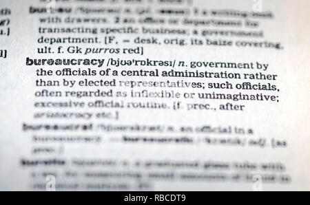 Close up of the word bureaucracy on a page inside an English dictionary - bureaucracy concept Stock Photo
