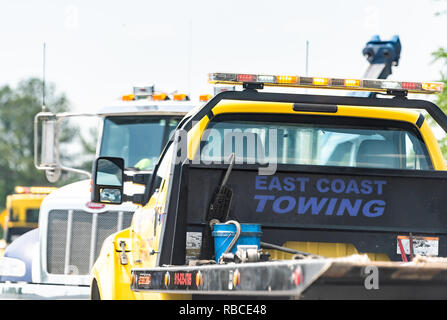 Raleigh, USA - May 13, 2018: Highway road in North Carolina with closeup of East Coast towing truck car by accident crash Stock Photo