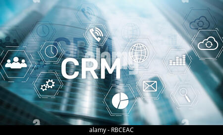 CRM, Customer relationship management system concept on abstract blurred background. Stock Photo