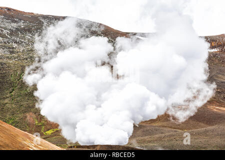 Viti Crater in Krafla caldera geothermal industrial smoke steam vapor landscape from power plant Stock Photo