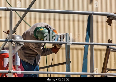 Metal Worker Using Grinder Stock Photo