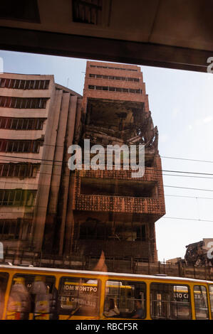 Belgrade, Serbia - June 09, 2013: View from autobus window on destroyed part of downtown building in Belgrade after airstrikes in civil war Stock Photo