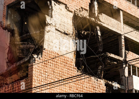 Belgrade, Serbia - June 09, 2013: View from autobus window on destroyed part of downtown building in Belgrade after airstrikes in civil war Stock Photo