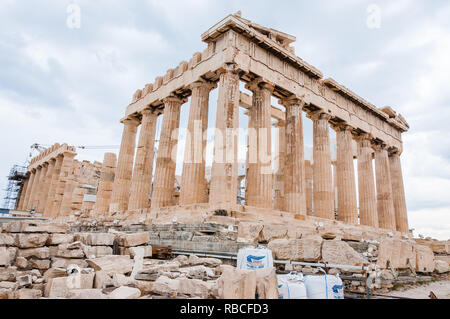 Athens, Greece - June 12, 2013: The famous Parthenon on Acropolis hill under reconstruction surrounded by scaffolding and standing big construction cr Stock Photo