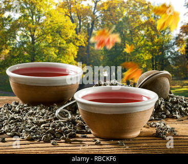 Two cups of tea in the autumn landscape Stock Photo