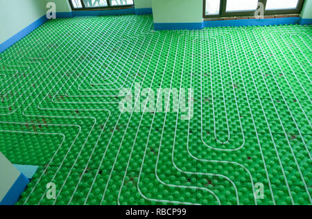 Green floor heating system - home installation Stock Photo