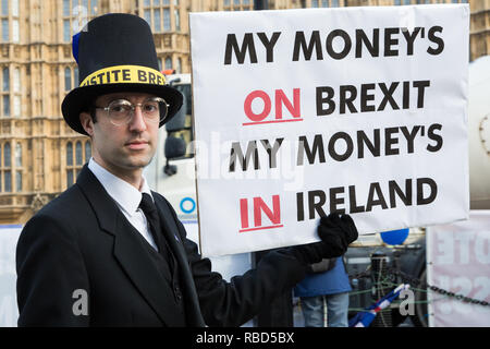 London, UK. 9th Jan, 2019. An anti-Brexit activist disguised as Jacob Rees-Mogg and carrying a sign reading 'My Money's on Brexit My Money's in Ireland' protests with pro-EU group SODEM (Stand of Defiance European Movement) outside Parliament on the first day of the debate in the House of Commons on Prime Minister Theresa May's proposed Brexit withdrawal agreement. Credit: Mark Kerrison/Alamy Live News Stock Photo