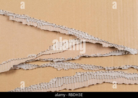 Beige torn cardboard ragged edge texture background. Stock Photo