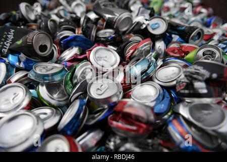 Gillette, Wyoming / July 25 2017: Aluminum Can Recycling, large pile of smashed, crushed, empty, beer and soda beverage cans for scrap metal recycling Stock Photo