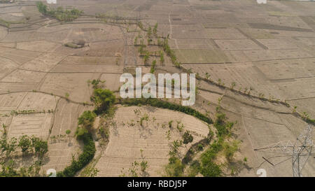 Electricity pylons bearing power supply across rural landscape. aerial ...