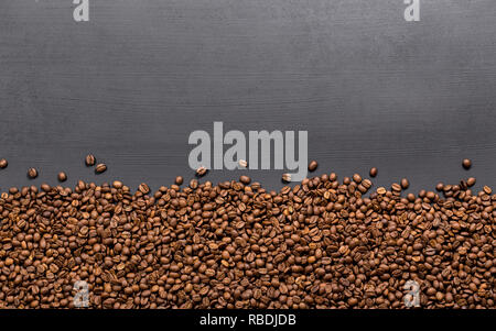 Coffee beans frame on black table Stock Photo