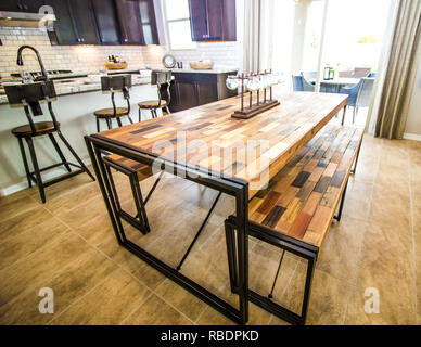 Modern Kitchen With Unique Parquet Wood Table And Benches Stock Photo