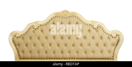 Shaped pastel beige color soft tufted leather capitone bed headboard of Chesterfield style sofa with carved wooden frame, isolated on white background Stock Photo