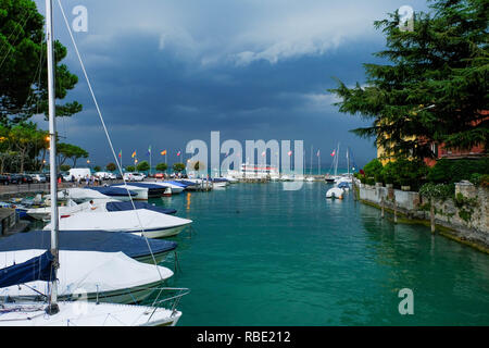 Sirmione, Italy - August 09, 2018: Berth at Lake Garda in the Italian town of Sirmione. Stock Photo