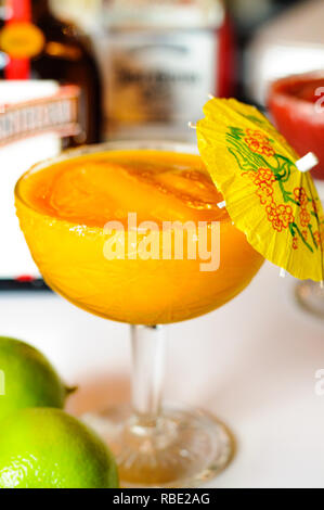 Frozen Daiquiri Cocktail with ingredients in the background Stock Photo