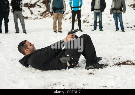 Pozarevac, Serbia - December 21-24, 2018: Large group of kapap students practice action gun shooting on target in the shooting range GROM on KAPAP BAS Stock Photo