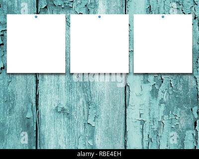 Three square blank frames on aqua weathered wooden background Stock Photo