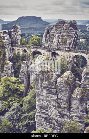 Retro toned picture of the Bastei Bridge in Saxon Switzerland National Park, Germany. Stock Photo