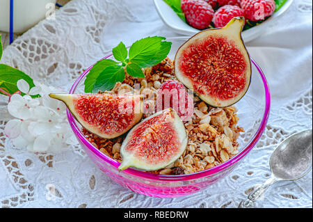 Healthy breakfast with muesli, milk, and fresh berries on a light napkin, selective focus. Stock Photo