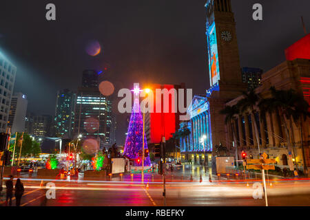 BRISBANE, AUSTRALIA, DEC 17 2018: Lightning of Christmas Tree and Laser show on the City Hall building at King George square, Brisbane, Australia. Stock Photo