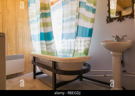 Bathroom With Freestanding Bathtub And Pedestal Sink Inside A Rustic 11 5 X 32 Foot Open Concept Design Mini House Stock Photo Alamy