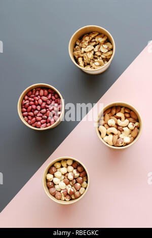 Walnut, Peanuts, Hazelnuts, Cashews in Boxes on a Combined Back Stock Photo