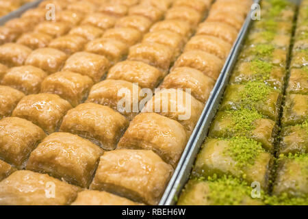 Traditional Turkish dessert Baklava close-up in the local Baklava shop in Turkey Stock Photo