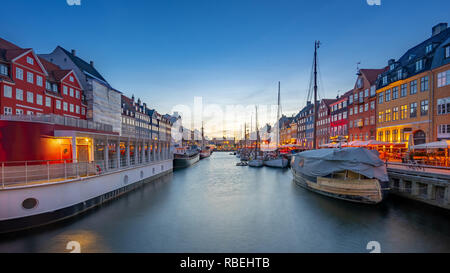 Copenhagen city at night with view of Nyhavn in Denmark. Stock Photo